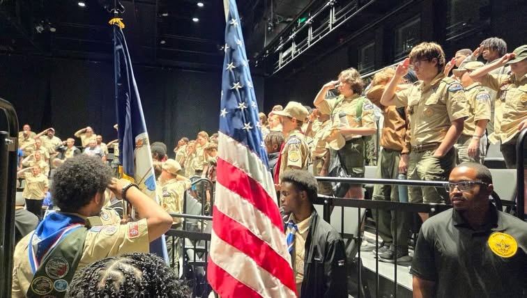 Scouts salute during the presentation of colors