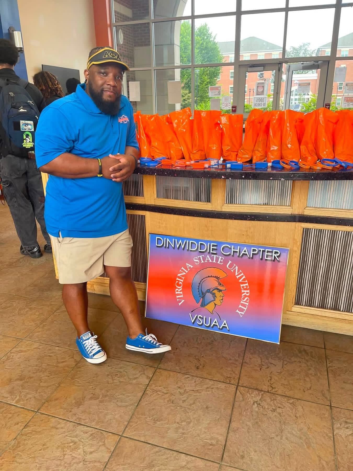 A chapter brother with welcome bags at VSU freshman move-in